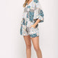 Patchwork Printed Surplice Romper With Waist Tassel Tie And Bottom Lining