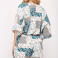 Patchwork Printed Surplice Romper With Waist Tassel Tie And Bottom Lining